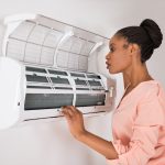 woman trying to determine if her hvac unit was overtaxed